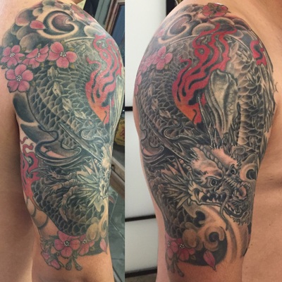 Japanese Asian dragon half sleeve fire cherry blossoms  tattoo by Derek Dufresne Space Tiger Tattoos 2709 St Claude ave, New Orleans, LA